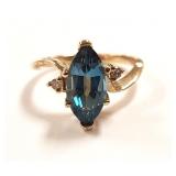 10K gold ring set with marquis cut blue topaz with