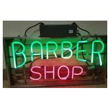 Antique neon barber shop sign in green & red