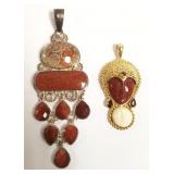 2 signed Sajen sterling pendants set with