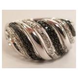 Sterling ring set with 1/4 tcw black & clear
