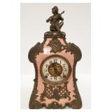 Antique fancy metal clock with figural top