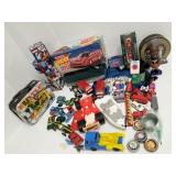 Group assorted toys - cars, trucks, puzzles, etc.
