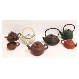 6 oriental teapots - iron, pottery, etc. & a