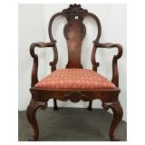 Antique carved upholstered armchair with inlaid