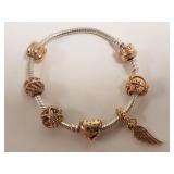 Pandora charm bracelet .925 sterling with 6 rose