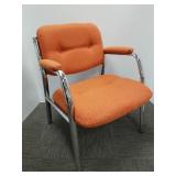 Upholstered chrome arm chair