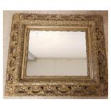 Antique ornately framed mirror approx 24"x 30"