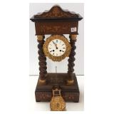 Antique pillar clock with inlaid case & ornate