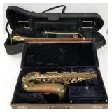 Getzen brass trombone in case & Conn brass