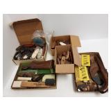 Large group of gun parts including grips, butt