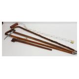 4 assorted walking sticks & carved swagger stick