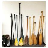 8 wood canoe paddles and 6 plastic paddleboard