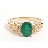 14K gold ring set with 5.5 x 7 mm oval cut emerald