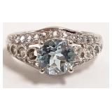 14K white gold ring set with blue center stone -