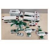 Group of Hess toy trucks, cars, helicopters, etc.