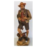 Signed 19 1/2" tall carved wood Swiss hunter &