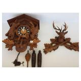 German carved cuckoo clock with game motif 18"