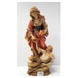 Swiss carved wood figure of woman feeding the