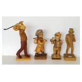 4 Swiss, etc. carved wood figures including golfer