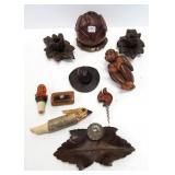 Group of wood carvings including inkwells, ape,