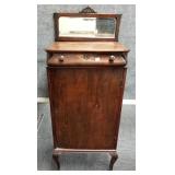 Antique sheet music cabinet with beveled mirror-