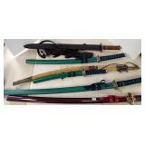 6 assorted contemporary etc. swords & a rack