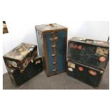 Group of antique suitcase with travel stickers &