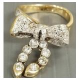 14k gold articulated bow ring s/w diamonds: 6.0g,