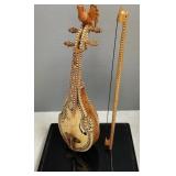 Signed & inlaid stringed instrument in lucite