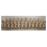12 carved wood Nias Warriors mounted on board-