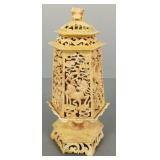 Asian ornately carved stone lantern with dragons