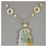 14K gold & carved jade pendant necklace w/ circle
