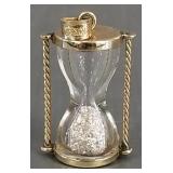 10K gold hourglass charm w/ diamond dust- 2.6g