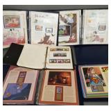 4 albums asst. Disney collectors panels & stamps