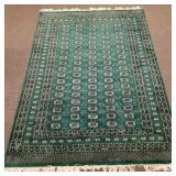 Hand tied oriental Bokhara pattern area rug-