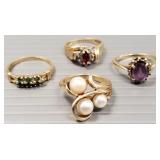 Four- 10k gold rings s/w stones- 10.9g total,