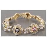 Sterling silver bracelet s/w ruby, emerald &