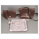 3 Coach leather, etc purses: largest 8'x 11'