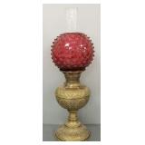 Antique ornate brass Royal oil lamp with cranberry