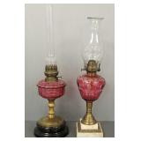 2 antique cranberry glass oil lamps: 1 is cut