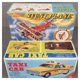 2 Japan tin battery op toys- stunt plane & a Taxi