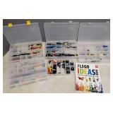 Gp Lego parts in divided boxes with a Lego book