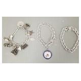 3 sterling silver bracelets- some w/ charms incl