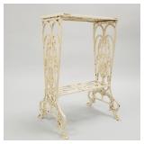 Painted cast iron stand with faces & claw feet-
