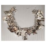 Sterling silver charm bracelet with many sterling