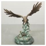 Brass eagle sculpture w/ leaping fish on stone