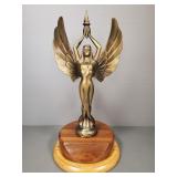 Brass figural trophy on a walnut & oak base-