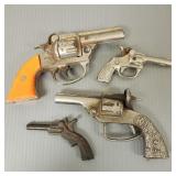 4 cast iron cap guns incl Gene Autry, Kilgore, etc