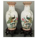 2 large Chinese decorated porcelain vases on wood