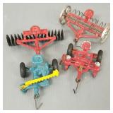 4 antique Arcade cast iron tractor implements: